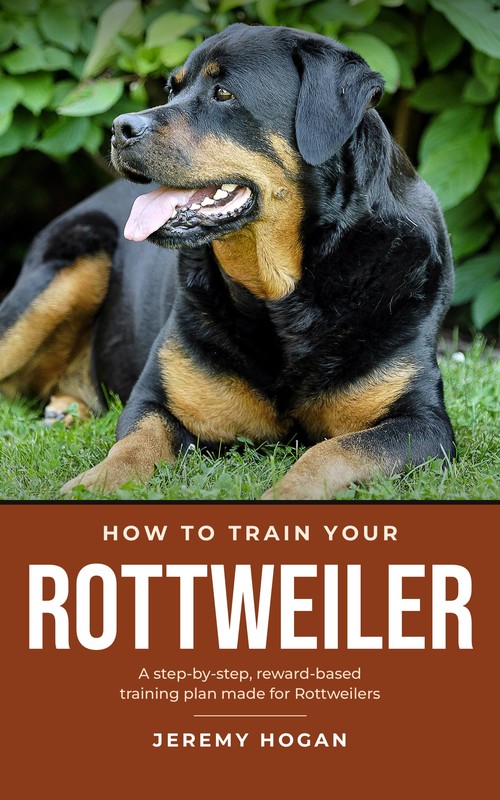 Cover of How to Train Your Rottweiler by Jeremy Hogan, showing an adult Rottweiler lying in the grass